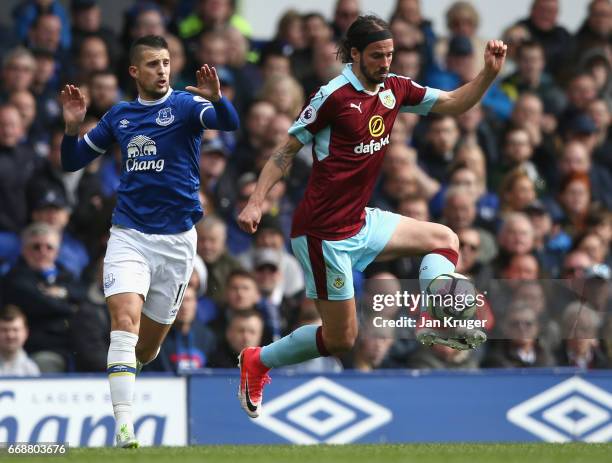Kevin Mirallas of Everton puts pressure on George Boyd of Burnley during the Premier League match between Everton and Burnley at Goodison Park on...