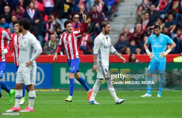 Sporting Gijon's Croatian forward Duje Cop celebrates after scoring a goal during the Spanish league football match Real Sporting de Gijon vs Real...