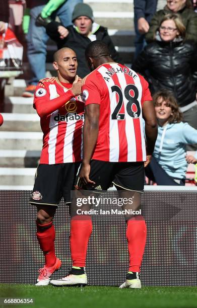 Wahbi Khazri of Sunderland celebrates scoring his sides first goal with Victor Anichebe of Sunderland during the Premier League match between...