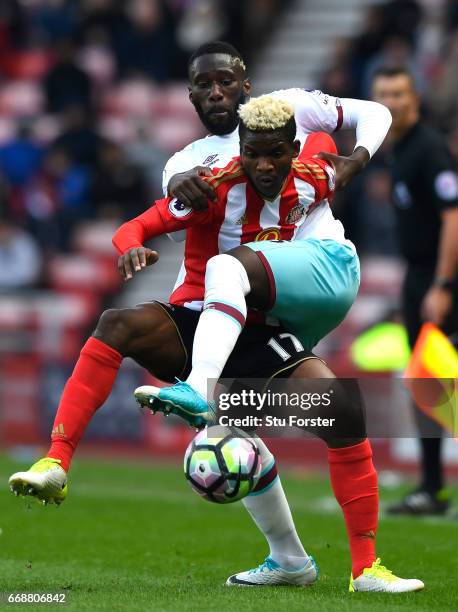 Dider N'dong of Sunderland and Arthur Masuaku of West Ham United battle for possession during the Premier League match between Sunderland and West...