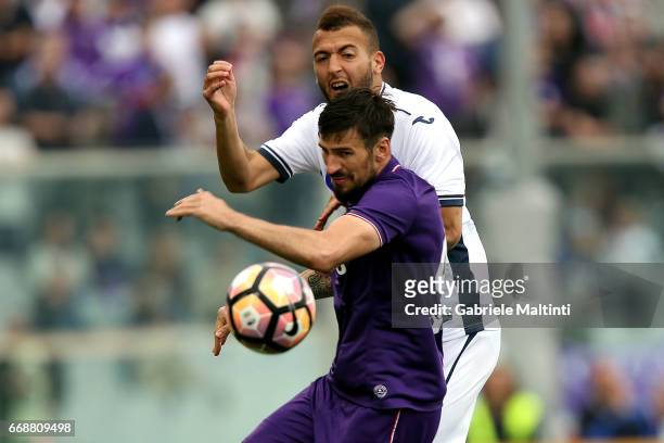 Nenad Tomovic of ACF Fiorentina battles for the ball with Omar El Kaddouri of Empoli FC during the Serie A match between ACF Fiorentina and Empoli FC...