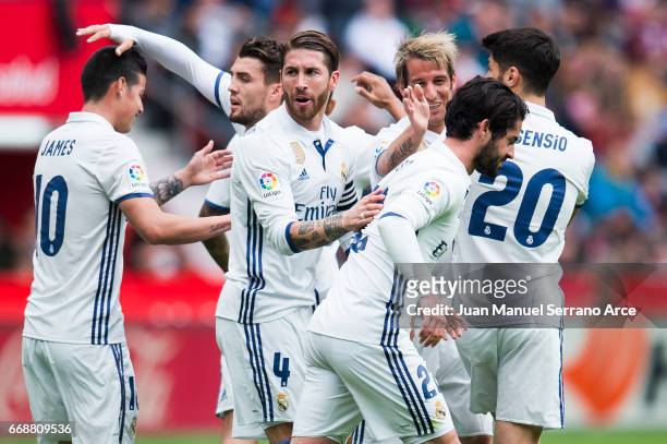 Isco of Real Madrid celebrates after scoring goal during the La Liga match between Real Sporting de Gijon and Real Madrid at Estadio El Molinon on...