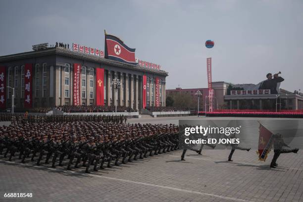 Korean People's Army soldiers watch a military parade marking the 105th anniversary of the birth of late North Korean leader Kim Il-Sung, in...