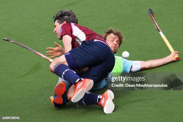 Simon Mantell of Wimbledon and Moritz Furste of UHC Hamburg crash into each other during the Euro Hockey League KO16 match between Wimbledon and UHC...