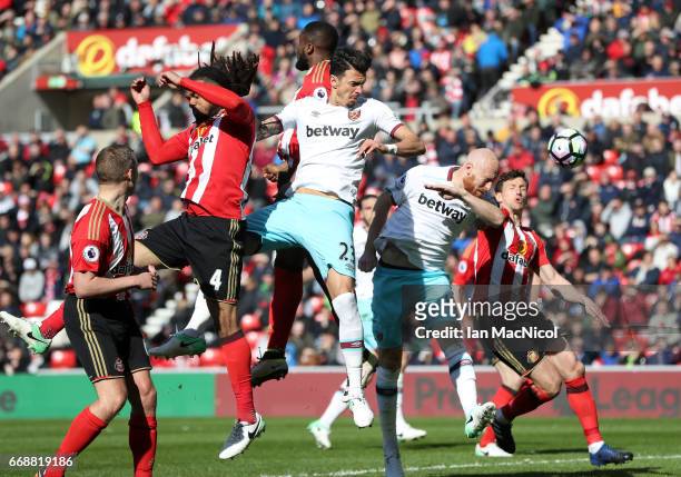 James Collins of West Ham United scores his sides second goal during the Premier League match between Sunderland and West Ham United at Stadium of...
