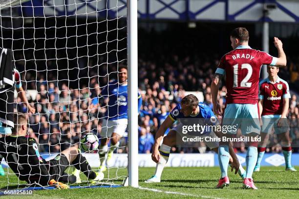 Phil Jagielka of Everton scores the first goal to make the score 1-0 during the Premier League match between Everton and Burnley at Goodison Park on...