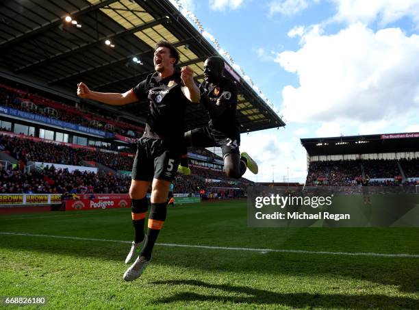 Harry Maguire of Hull City celebrates scoring his sides first goal with Oumar Niasse of Hull City during the Premier League match between Stoke City...