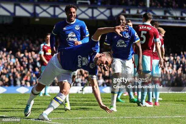 Phil Jagielka of Everton celebrates scoring the first goal to make the score 1-0 during the Premier League match between Everton and Burnley at...