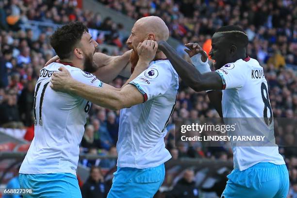 West Ham United's Welsh defender James Collins celebrates scoring West Ham's second goal with West Ham United's Scottish midfielder Robert Snodgrass...