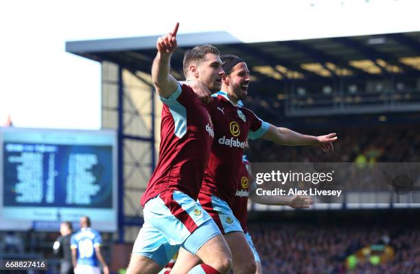 Sam Vokes of Burnley celebrates scoring his sides first goal with George Boyd of Burnley during the Premier League match between Everton and Burnley...