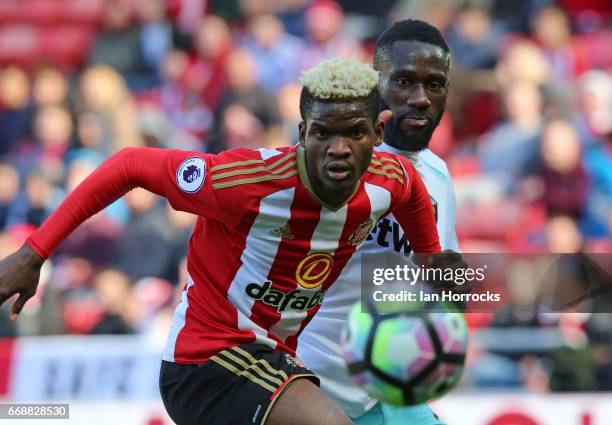 Arthur Masuaku of West Ham challenges Didier N'Dong of Sunderland during the Premier League match between Sunderland and West Ham United at Stadium...