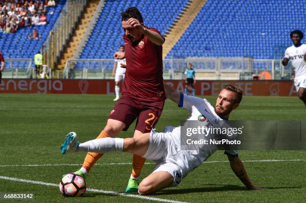Andrea Conti of Atalanta challenges Mário Rui of AS Roma during the italian Serie A match between Roma and Atalanta at the Olympic Stadium, Rome,...