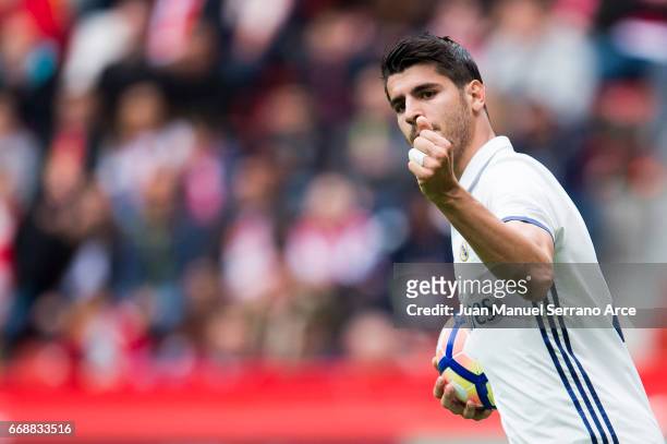 Alvaro Morata of Real Madrid celebrates after scoring his team's second goal during the La Liga match between Real Sporting de Gijon and Real Madrid...