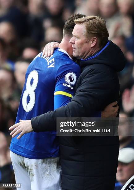 Ross Barkley of Everton is embraced by his Manager / Head Coach Ronald Koeman during the Premier League match between Everton and Burnley at Goodison...