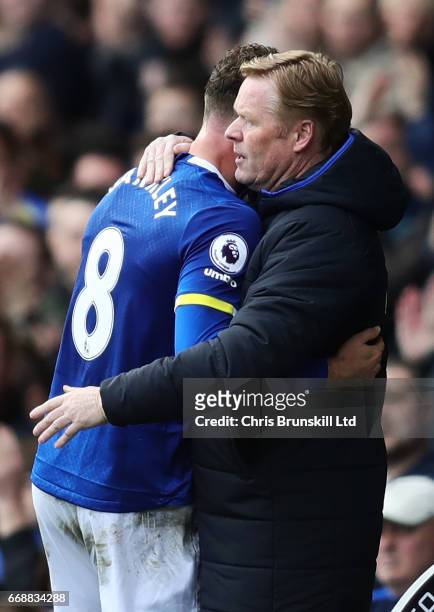 Ross Barkley of Everton is embraced by his Manager / Head Coach Ronald Koeman during the Premier League match between Everton and Burnley at Goodison...