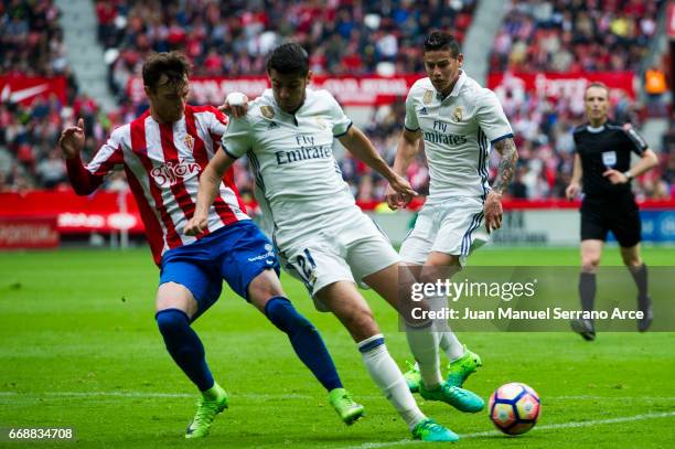 Alvaro Morata of Real Madrid duels for the ball with Fernando Amorebieta of Real Sporting de Gijon during the La Liga match between Real Sporting de...