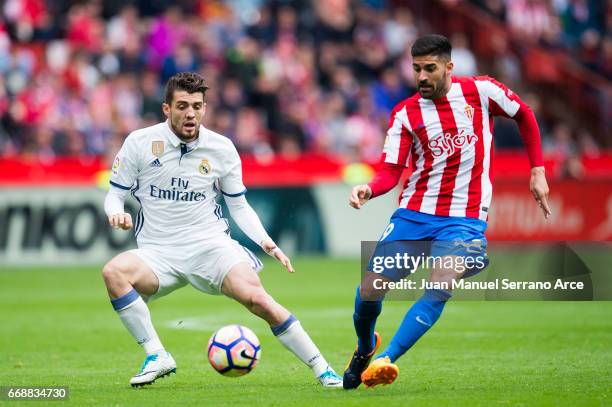 Mateo Kovacic of Real Madrid duels for the ball with Carlos Carmona of Real Sporting de Gijon during the La Liga match between Real Sporting de Gijon...