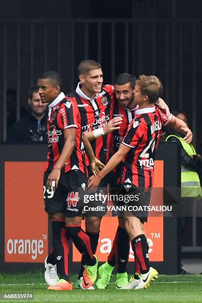 Nice's French forward Mickael Le Bihan celebrates with his teammates after scoring a goal during the French L1 Football match between OGC Nice and AS...