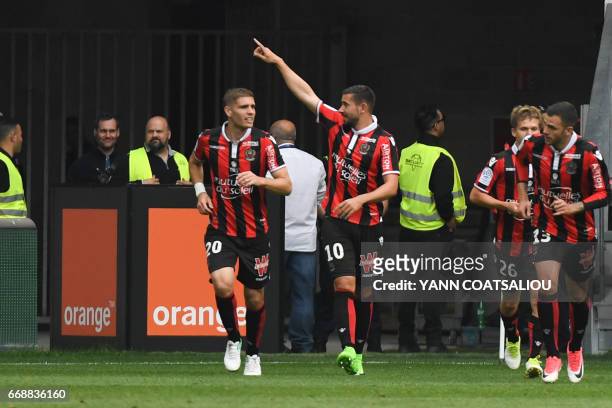 Nice's French forward Mickael Le Bihan celebrates with his teammates after scoring a goal during the French L1 Football match between OGC Nice and AS...