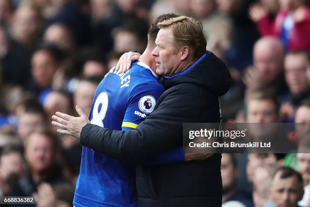 Ross Barkley of Everton is embraced by his Manager / Head Coach Ronald Koeman during the Premier League match between Everton and Burnley at Goodison...