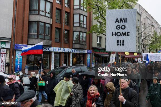 &quot;Yankee go home!!!&quot; written on a demonstrator's sign in Berlin, Germany, 15 April 2017. Several hundren people took part in the Easter...