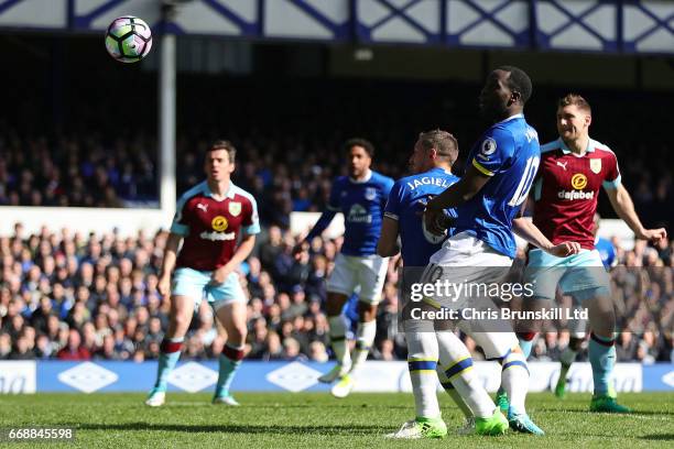 Phil Jagielka of Everton scores the first goal to make the score 1-0 during the Premier League match between Everton and Burnley at Goodison Park on...