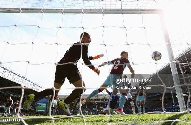 Phil Jagielka of Everton scores his sides first goal during the Premier League match between Everton and Burnley at Goodison Park on April 15, 2017...