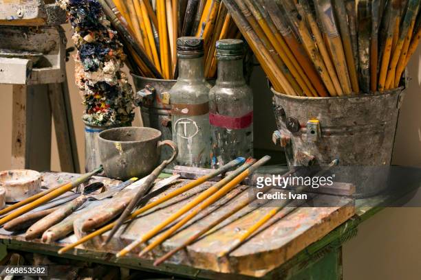 many used paint brushes and oil paint tubes - japanese brush stroke stock pictures, royalty-free photos & images