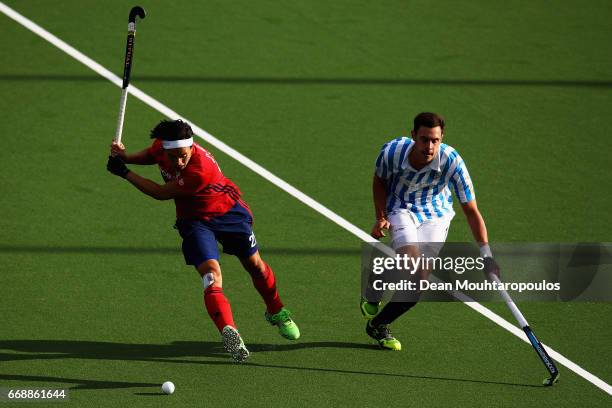 Danny Nguyen of Mannheimer HC shoots on goal in front of Ignasi Use of Club Egara during the Euro Hockey League KO16 match between Mannheimer HC and...