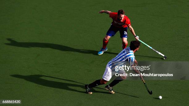 Pau Quemada of Club Egara battles for the ball with Maximilian Neumann of Mannheimer HC during the Euro Hockey League KO16 match between Mannheimer...