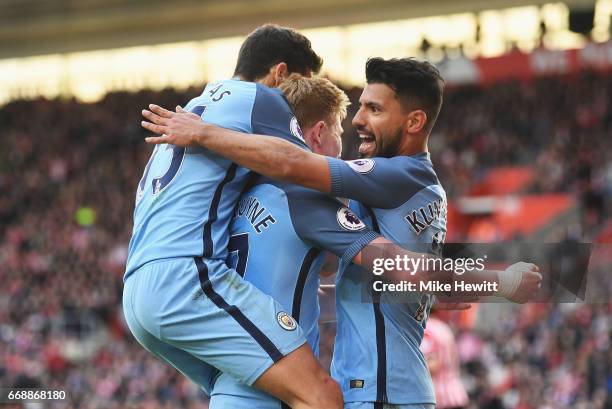 Sergio Aguero of Manchester City celebrates scoring his sides third goal with Kevin De Bruyne of Manchester City and Jesus Navas of Manchester City...