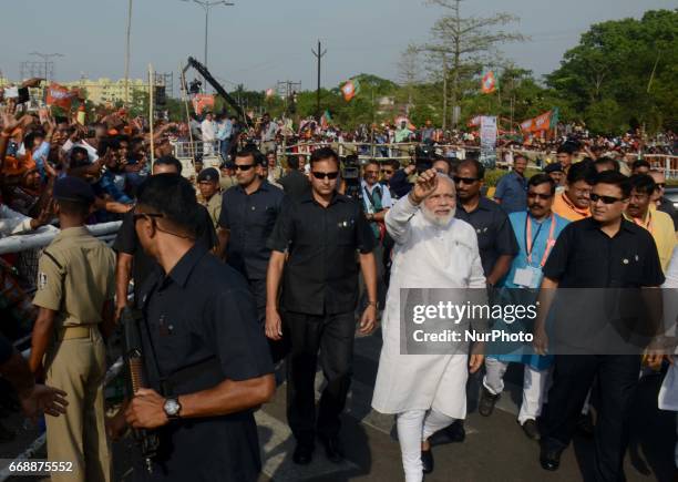 Prime Minister of India Narendra Modi waves to crowd after arrives in the eastern Indian state Odisha's capital city Bhubaneswar on 15 April 2017,...