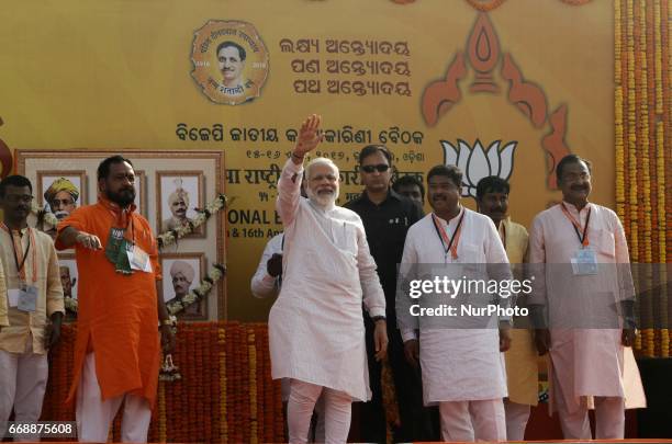 Prime Minister of India Narendra Modi waves to crowd after arrives in the eastern Indian state Odisha's capital city Bhubaneswar on 15 April 2017,...