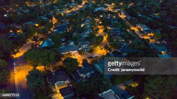 aerial residential neighborhood at night - street light stock pictures, royalty-free photos & images