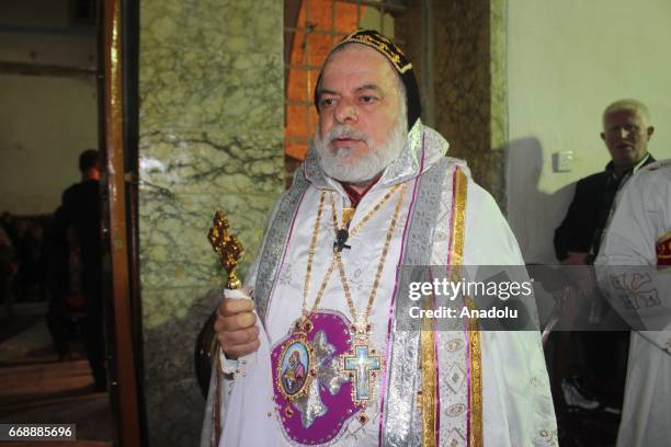 Pope Moussa Shamani chairs a mass during Easter celebrations at the Mar Korkeis Church in Bashiqa Town of Mosul, Nineveh, Iraq on April 15, 2017....