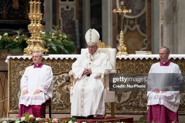 Pope Francis leads solemn Easter vigil ceremony celebrated n St. Peter's Basilica at the Vatican, Saturday, April 15, 2017.