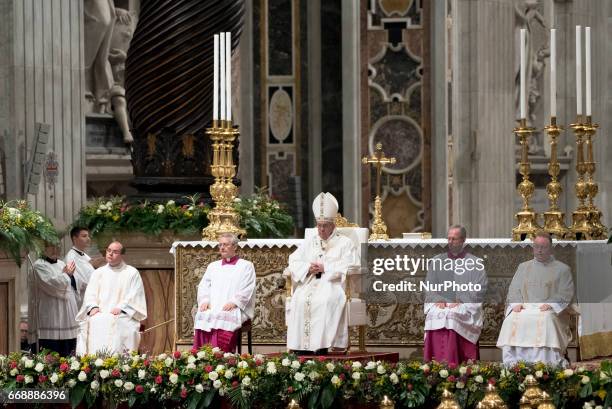 Pope Francis leads solemn Easter vigil ceremony celebrated n St. Peter's Basilica at the Vatican, Saturday, April 15, 2017.