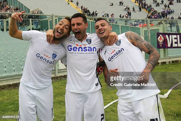 Omar El Kaddouri, Frederic Veseli and Rade Krunic of Empoli FC celebrates the victory after during the Serie A match between ACF Fiorentina and...