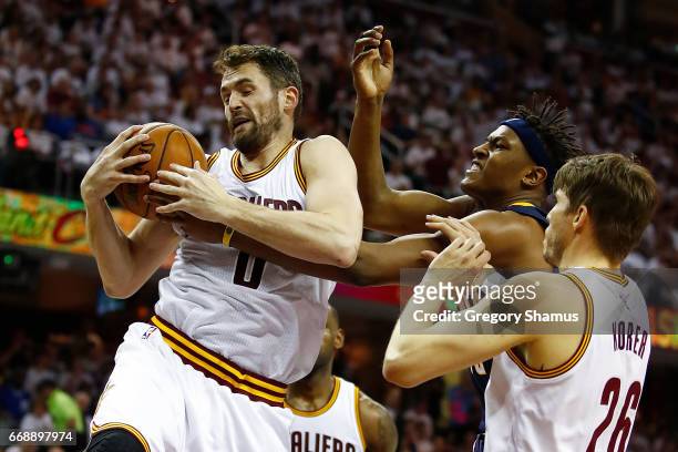 Kevin Love of the Cleveland Cavaliers grabs a first half rebound next to Myles Turner of the Indiana Pacers in Game One of the Eastern Conference...