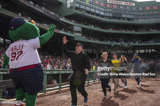 Members of the John Hancock Boston Marathon team are introduced during a ceremony before a game between the Boston Red Sox and the Tampa Bay Rays on...