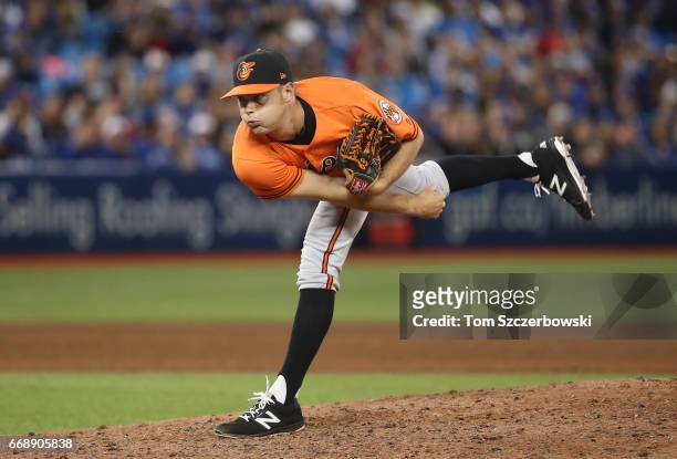 Tyler Wilson of the Baltimore Orioles delivers a pitch in the ninth inning during MLB game action against the Toronto Blue Jays at Rogers Centre on...