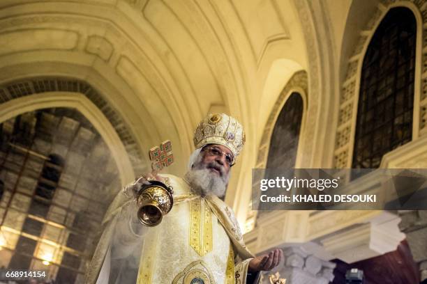 Egyptian Coptic Pope Tawadros II leads the Easter mass at the Saint Mark's Coptic Cathedral, in Cairo's al-Abbassiya district on April 15, 2017.