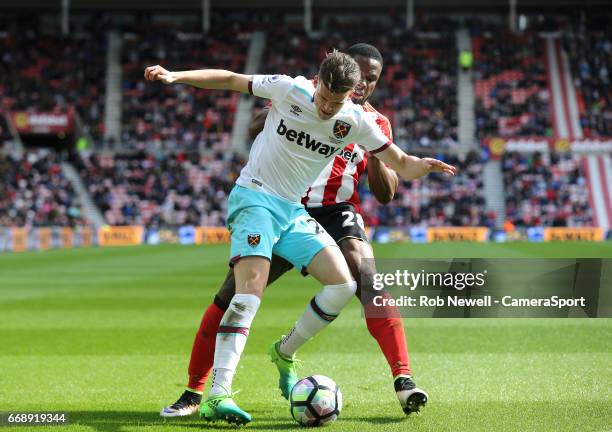 West Ham United's Sam Byram and Sunderland's Victor Anichebe during the Premier League match between Sunderland and West Ham United at Stadium of...