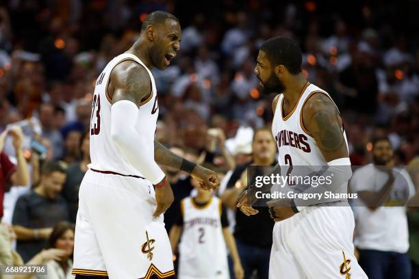 LeBron James of the Cleveland Cavaliers celebrates a second half dunk with Kyrie Irving while playing the Indiana Pacers in Game One of the Eastern...