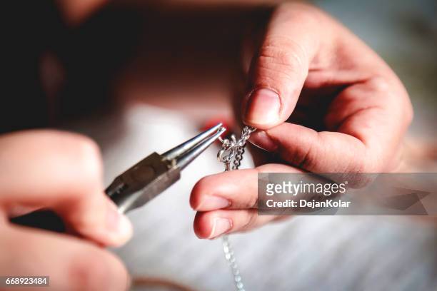 young woman crafting jewelry - jewelry stock pictures, royalty-free photos & images