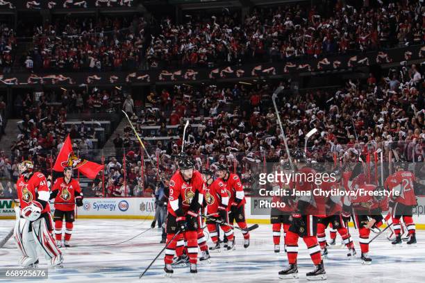 Members of the Ottawa Senators acknowledge their fans following their overtime win against the Boston Bruins in Game Two of the Eastern Conference...