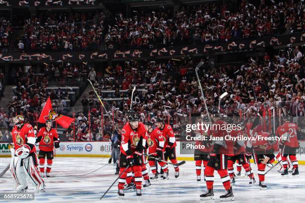 Members of the Ottawa Senators acknowledge their fans following their overtime win against the Boston Bruins in Game Two of the Eastern Conference...