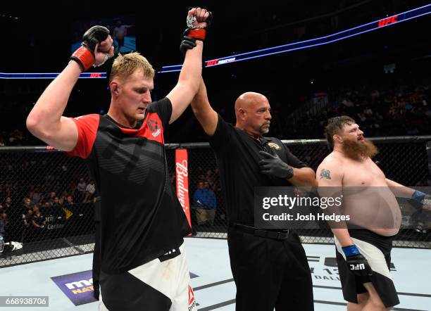 Alexander Volkov of Russia celebrates his victory over Roy Nelson in their heavyweight fight during the UFC Fight Night event at Sprint Center on...