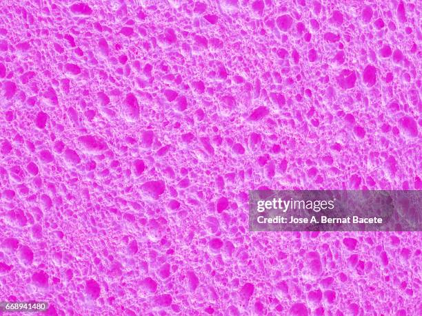full frame of coarse and wavy textures of colored foam, pink background - abstracto photos et images de collection