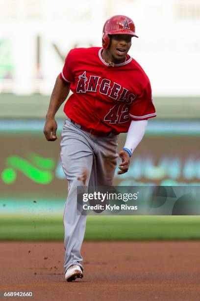 Ben Revere of the Los Angeles Angels of Anaheim rounds second and heads to third against the Kansas City Royals at Kauffman Stadium on April 15, 2017...